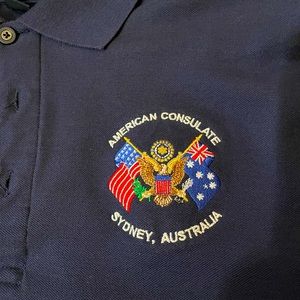 Men’s polo shirt with Consulate Of Australia logo.